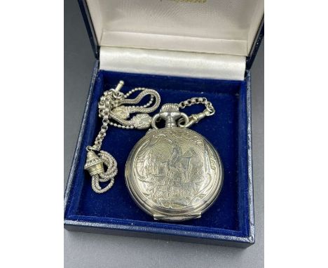 A Hebdomas Eight Day pocket watch with engraved hunting themed case, and chain.