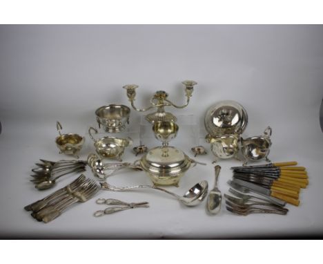 A quantity of silver-plated items, comprising various items including two pairs of sauce boats, muffin dish and cover, small 