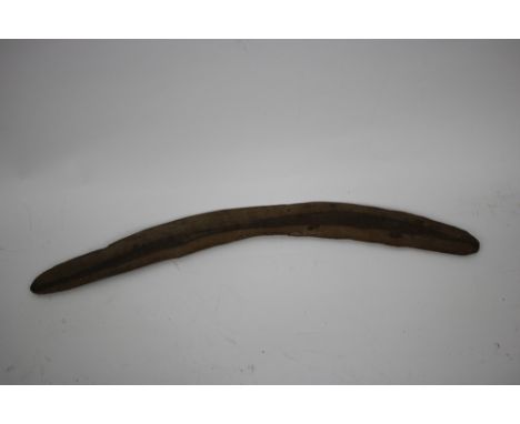 A vintage Australian boomerang, made of wood , length 52.5cm.
