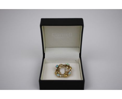 A Gold Opal and Seed Pearl Brooch, designed as a wreath, set with pear shaped opals and seed pearls. English hallmarks for 9c