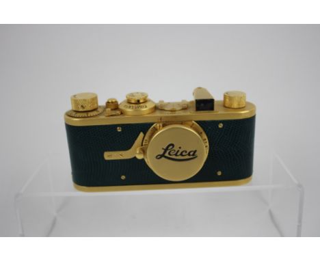 A LEICA "Luxus" Replica camera, Stamped No 11052 with green reptile leather in good overall condition (see photos).approx.&nb