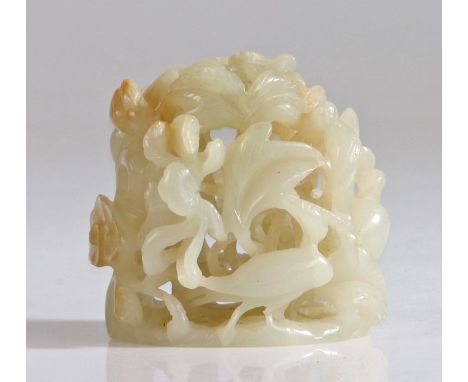 A Chinese jade finial, Yuan/Ming Dynasty, 13th/14th Century, slight russet coloured areas, deeply carved in openwork with a p