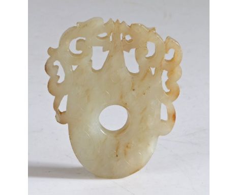 A Chinese jade plaque, Han Dynasty (206 B.C.-220 A.D.) of flattened form, the shoulders carved with two chilong confronting e