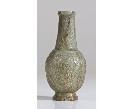 A Chinese jade vase, Qing Dynasty, 18th Century, the grey/green vase carved with a lotus flower design, 12cm highUK Private c