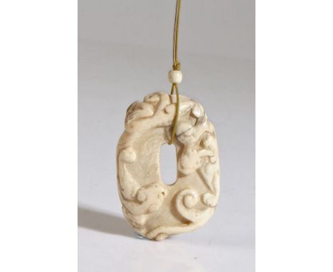A Chinese 'chicken bone' jade 'chilong' pendant, Song Dynasty (960 AD-1279 AD) with the encircling dragons to the top and sha