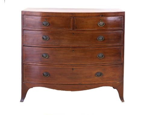 A Regency Mahogany, Satinwood-Banded, Boxwood and Ebony-Strung Bowfront Chest of Drawers, early 19th century, the two short o