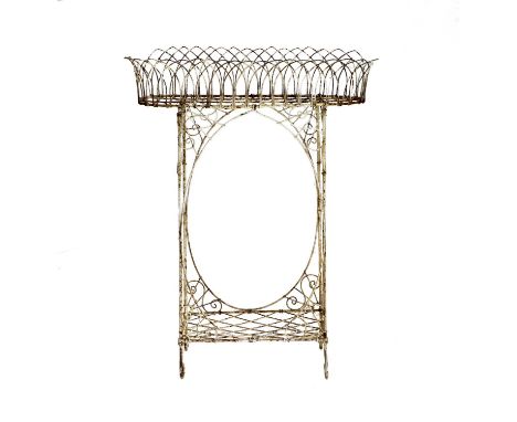 A Victorian White Painted Wirework Planter, of oval form, the scrolled supports joined by curved stretchers, the base joined 