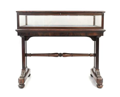 A Victorian Rosewood Display Table, 19th century and possibly adapted, the hinged lid enclosing a blue velvet lined interior,