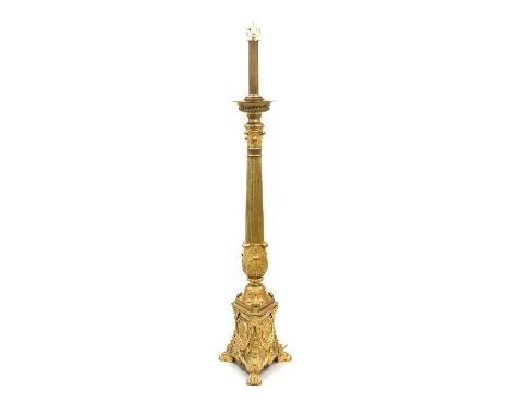 A Late 19th Century Ormolu and Brass Standard Lamp, the reeded and tapering column decorated with acanthus leaves, on a trifo