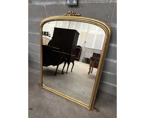 A Victorian Giltwood Overmantel Mirror, late 19th century, the original plain mirror plate within a moulded frame above a nar