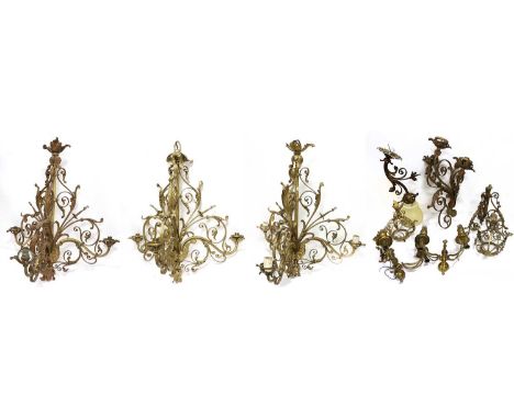 A Set of Three Gilt Metal Three-Light Chandeliers, in Louis XVI style, with scroll and leaf-sheathed branches70cm highTwo Sim