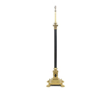 A Late Victorian Telescopic Brass Standard Lamp, late 19th/early 20th century, the rise-and-fall tubular pole above a Corinth
