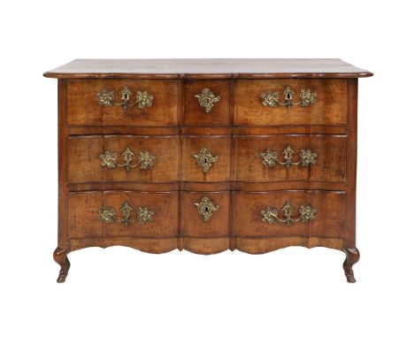 An 18th Century Fruitwood Serpentine Shape Commode, the moulded top above two short and two long pine-lined drawers with orig