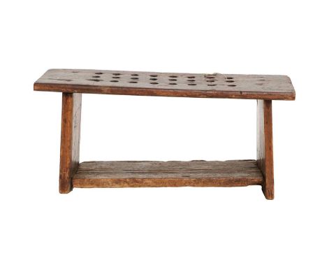 An 18th Century Provincial Oak and Pine-Sided Stool, of four-plank construction, the top with twenty-four circular drill hole