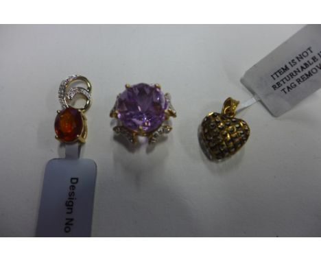 Three 9ct gold pendants including 9ct gold filigree heart stamped 9K, amethyst and diamond pendant fully hallmarked, orange K