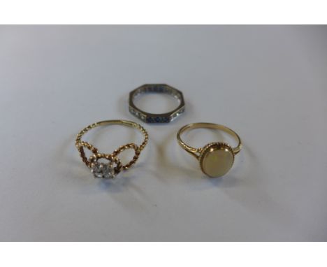 A hallmarked 9ct diamond ring, a hallmarked 9ct diamond ring and a white metal diamond and sapphire ring, sizes P, M and M, a