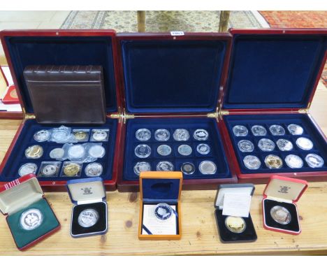 A collection of forty silver and other coins in three coin collectors cases, total weight approx 29 troy oz, this is an estim