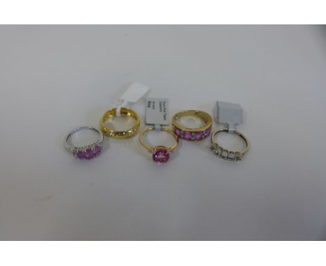 Four hallmarked 9ct gold rings and a 9ct band ring, marked 9ct approx 10 grams, all good or unused condition 