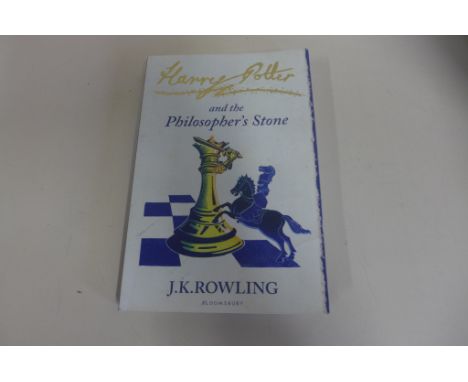 A Harry Potter and the Philosophers Stone, paperback, with signature of J K Rowling on page, signed by the author for the fam