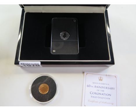 A boxed 1/10 oz platinum 1988 Canadian 30 Dollar coin and a 9ct 1 gram coin 