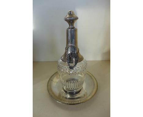 An Egyptian silver dish, 18cm diameter, approx 5.5 troy oz, with a continental silver and cut glass decanter, 24cm tall of si
