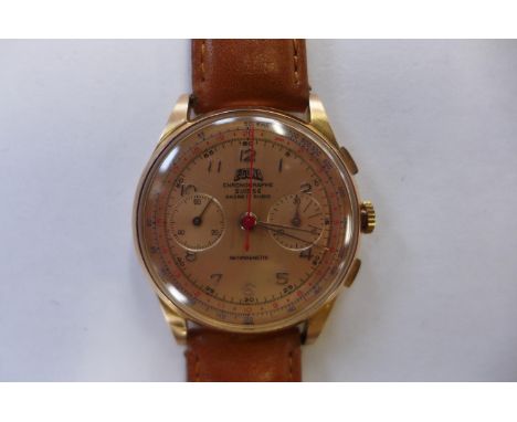 An 18ct yellow gold Egona chronograph gents manual wind wristwatch on a leather strap, 35mm wide, approx total weight 46 gram