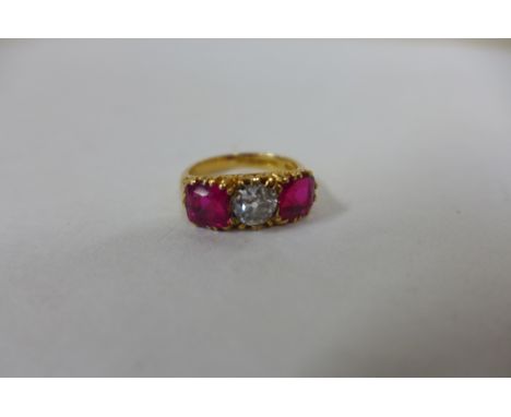 A good diamond  and synthetic ruby hallmarked 18ct yellow gold ring, central diamond approx 0.50ct, rubies measure approx 6x6