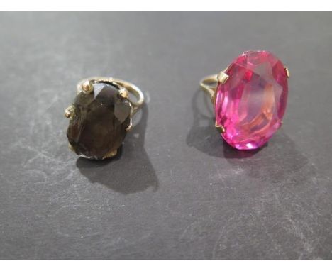 A 9ct gold and smokey quartz ring, stone measures approx 18x12mm, badly chipped, ring size L and a 9ct gold and red stone rin