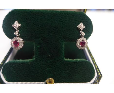 An 18ct white gold diamond and ruby drop earrings by Stockley Hatton Gardens London, fully hallmarked, diameter of fronts 9mm