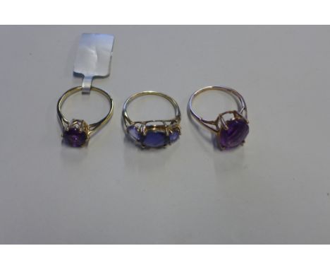 Three 9ct gold rings, including round amethyst size N, tanzanite, iolite and white zircon, size N 1/2 - oval amethyst size O,