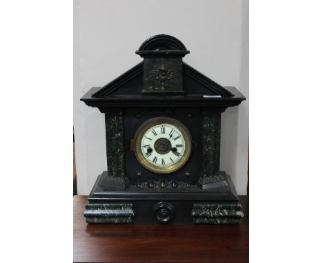 A late Victorian marble effect mantel clock