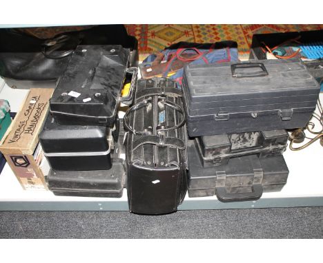 A collection of power tools, case of camera hand books, leather case of tools, drill etc