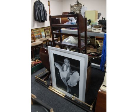 A framed monochrome print depicting Marilyn Monroe together with an Edwardian fire curb, two occasional tables, two-tier stan