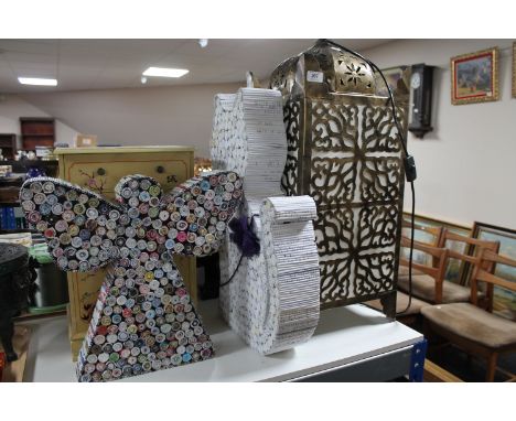 A contemporary lantern lamp, an oriental style small chest of drawers and two paper ornaments