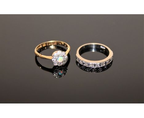 A white gold diamond half eternity ring and an 18ct gold diamond and opal cluster ring