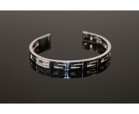 An 18ct gold diamond set bangle by Gucci, 28.2g (Cost £2,800 new) 