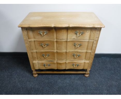 A continental light oak four drawer chest 