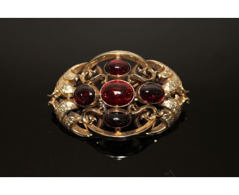 Large and impressive Victorian gold brooch set with cabochon garnets