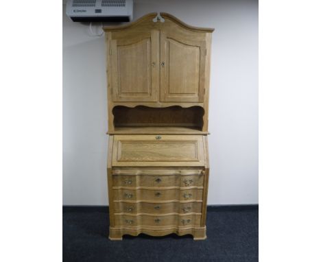 A continental light oak bureau bookcase 
