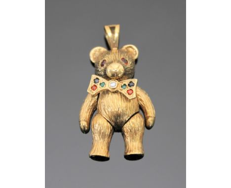 A gold pendant modelled as a bear, set with rubies, emeralds, sapphires and a central diamond, length 37mm, 7.5g.