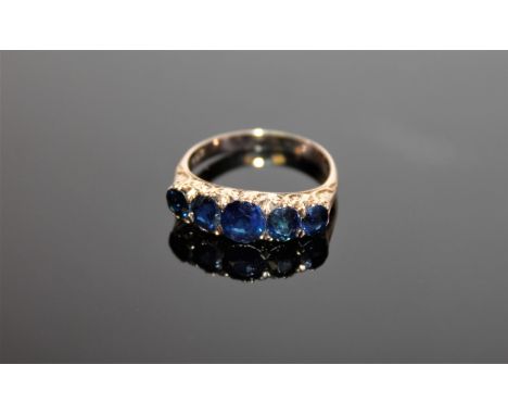 An antique five stone ring mounted on yellow gold shank, size R.