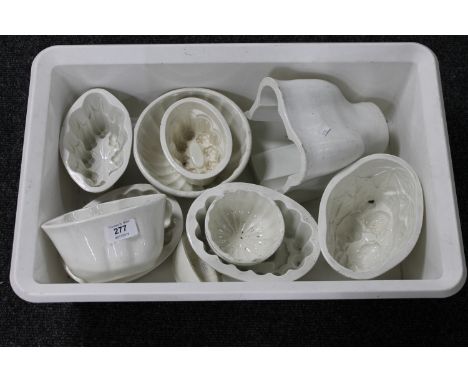 A box of antique ceramic pie moulds