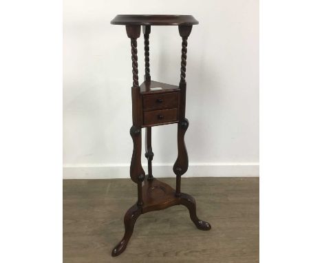 MAHOGANY WASH STAND, 20TH CENTURY the circular top above three barley twist supports, above two triangular shaped short drawe