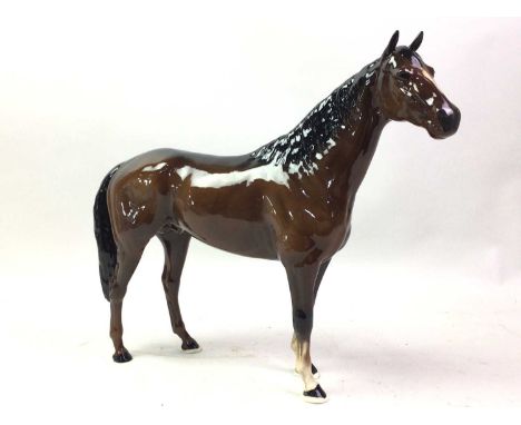 BESWICK MODEL OF A HORSE, AND A CERAMIC MODEL OF A GIRAFFE the giraffe modelled in the seated position giraffe 32cm highQty: 
