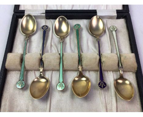 SET OF SIX SILVER GILT ENAMEL TEASPOONS, STAMPED HJH in fitted case