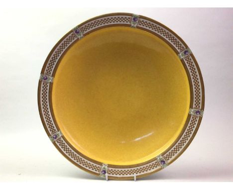ROYAL WORCESTER CIRCULAR BOWL, EARLY 20TH CENTURY  in yellow with gilt border  33.5cm diameter 