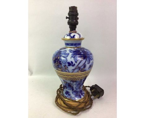 BLUE AND WHITE CERAMIC TABLE LAMP, ALONG WITH A BAROMETER the barometer cased in oakthe lamp 34cm high Qty: 2Restoration to t