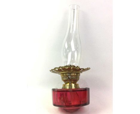 VICTORIAN BRASS AND CRANBERRY GLASS OIL LAMP, ALONG WITH TWO FURTHER LAMPS with glass shadesoil lamp 63cm high to tip of funn