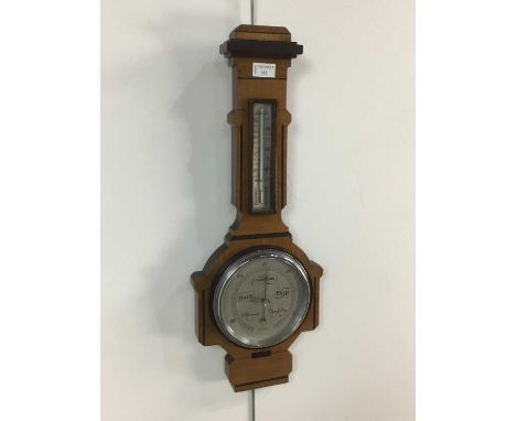 WALNUT BAROMETER/THERMOMETER, in carved case 62cm high