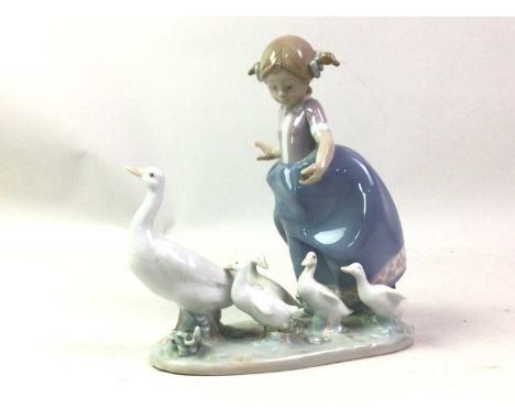 GROUP OF LLADRO FIGURES, AND NAO FIGURES including girl with geese, boy with dog, girl with hat and a panda26cm high